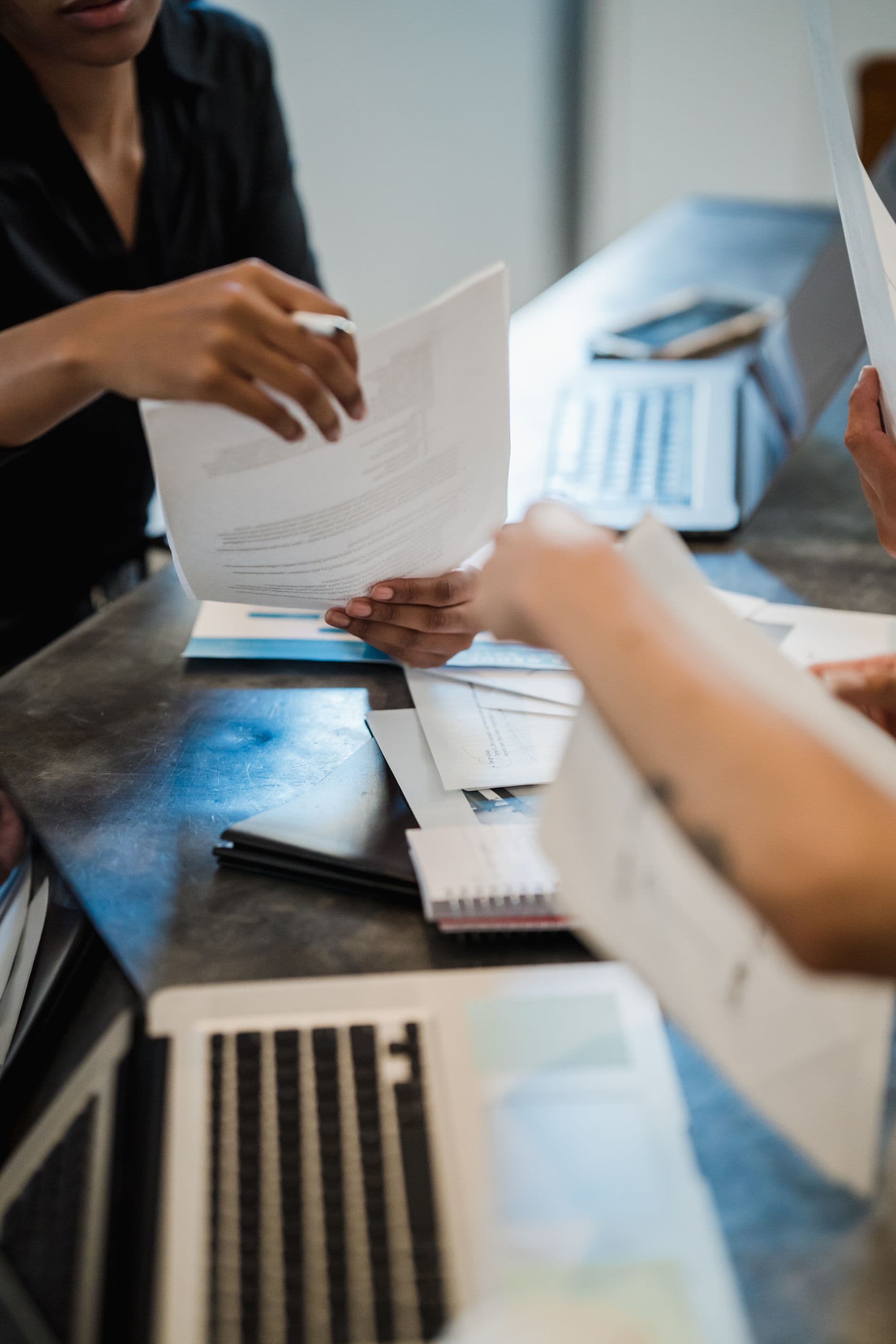 Documents handed over at a law firm reception desk