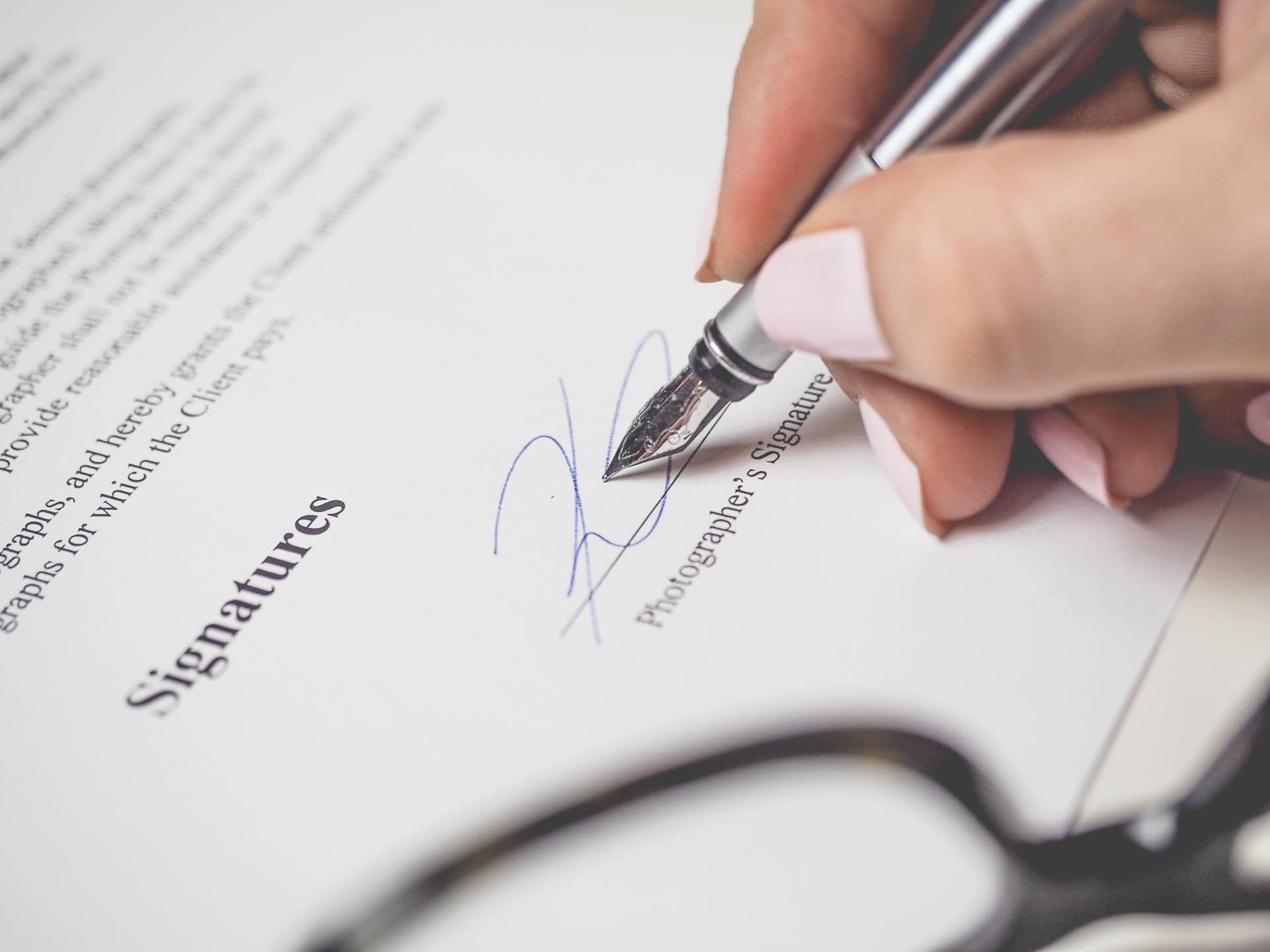 A fountain pen signing a contract